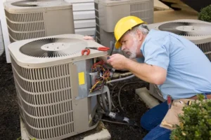 HVAC Technician working on air conditioning unit